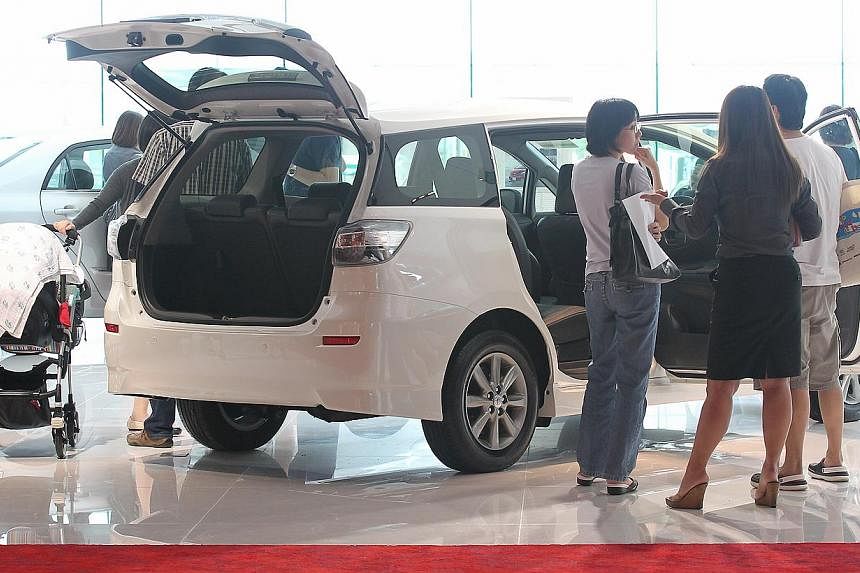 Potential car buyers at the Toyota showroom on Leng Kee Road. According to a study, car sales in Singapore are expected to jump 20 per cent in the next two years - the highest growth in the South-east Asian vehicle market. -- PHOTO: ST FILE&nbsp;