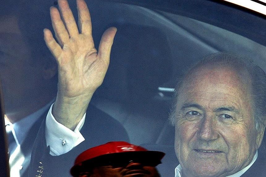 Sepp Blatter waves as he leaves the FNB stadium after visit to see the progress on the stadium in Soweto, South Africa for the WC2010 and the Confederation cup in a file photo taken in 2008. -- PHOTO: AFP