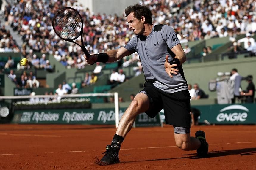 Andy Murray of Britain in action against David Ferrer of Spain during their quarterfinal match for the French Open tennis tournament at Roland Garros in Paris, France, on June 3, 2015. -- PHOTO: EPA