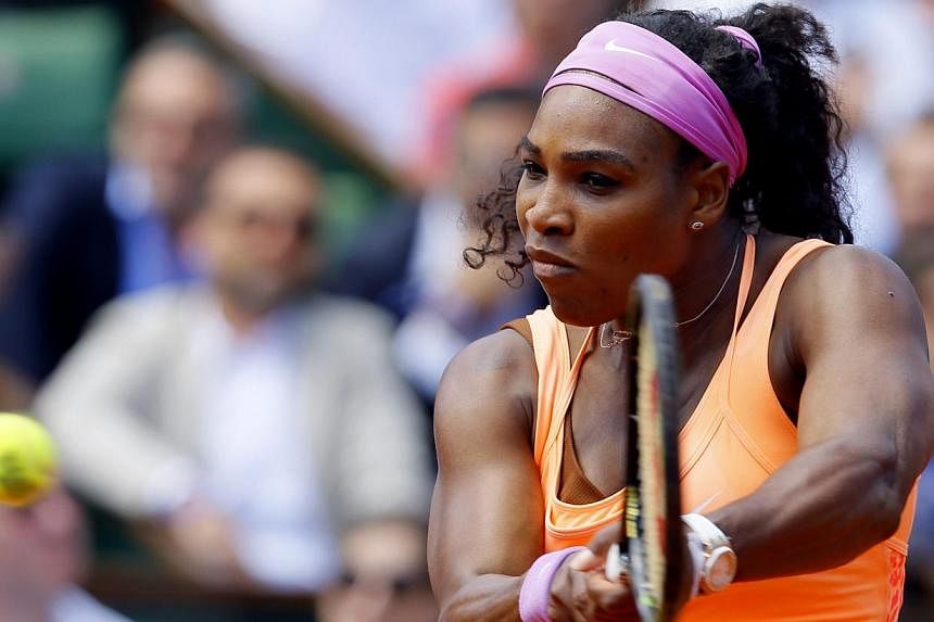 Serena Williams of the USA in action against.Sara Errani of Italy during their quarterfinal match for the French Open tennis tournament at Roland Garros in Paris, France on June 3, 2015. -- PHOTO: EPA