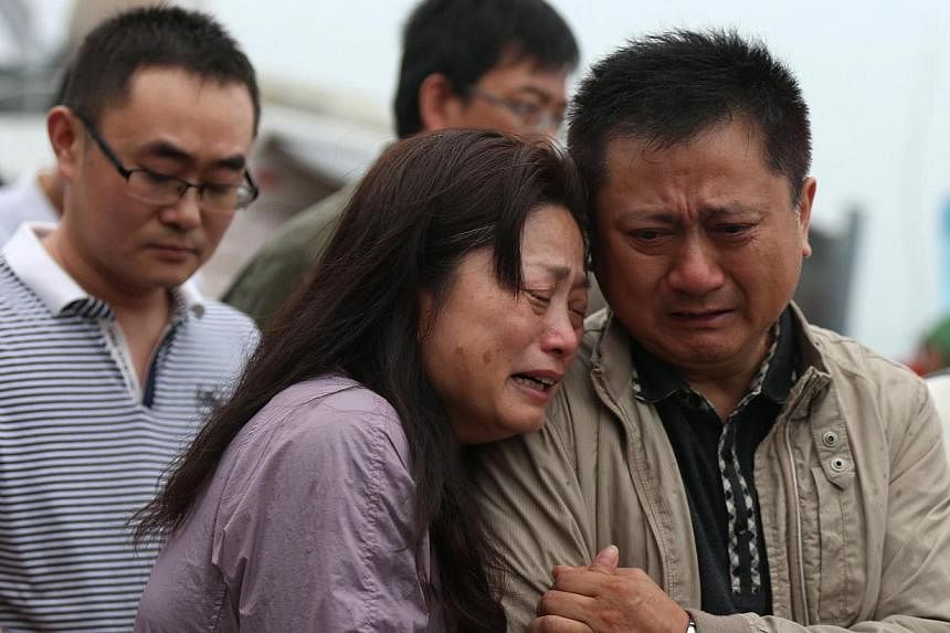 Relatives of passengers missing in the sinking of a cruise ship on the Yangtze River have accused Chinese police of beating them when they sought more information on the disaster. -- PHOTO: EPA&nbsp;