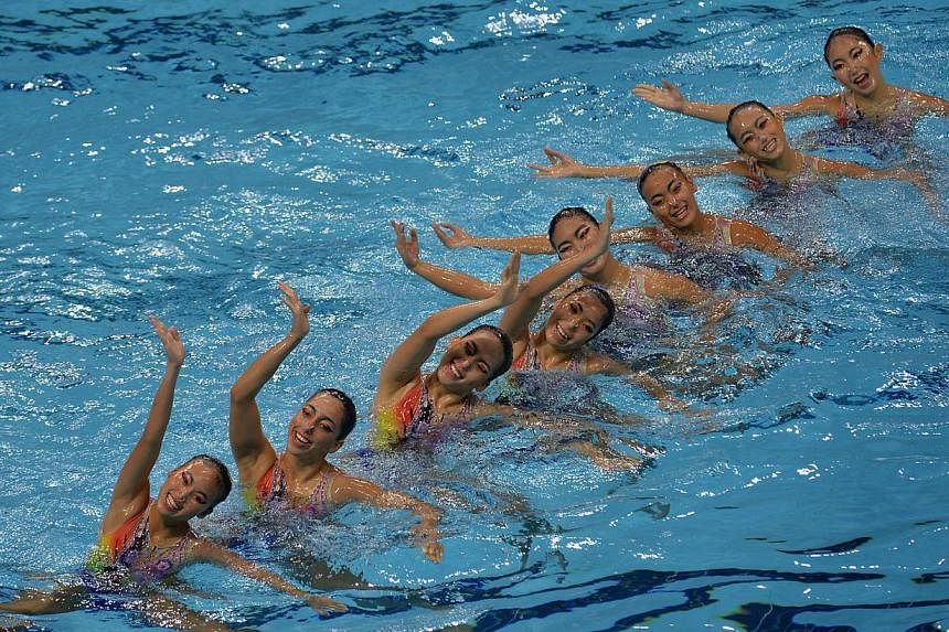 The Malaysian synchronised swimming team competing in the Team Free routine on June 3, 2015. -- ST PHOTO: CAROLINE CHIA&nbsp;