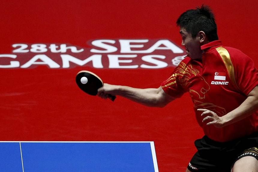 Singapore's Gao Ning hits a return to Richard Gonzales of the Philippines during their men's singles table tennis finals match at the Southeast Asian (SEA) Games in Singapore on June 4, 2015. -- PHOTO: REUTERS