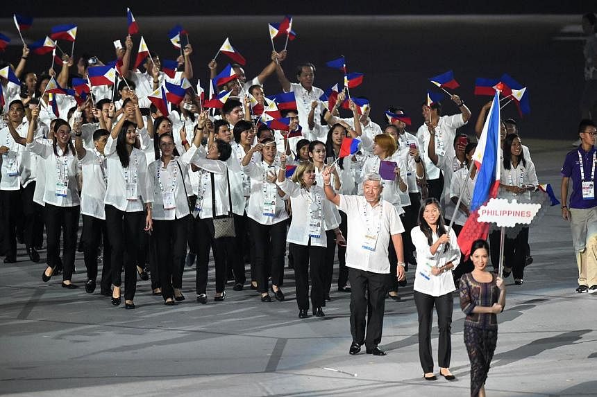 Athletes from the Philippines march during at the opening ceremony of the 28th SEA Games at the National Stadium on June 5, 2015. -- PHOTO: AFP