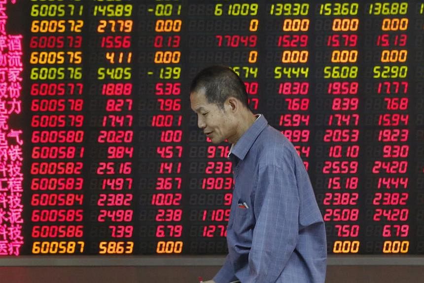 The Shanghai Composite Index climbed above 5,000 points for the first time in seven years, the latest milestone in a world-beating rally. -- PHOTO: EPA