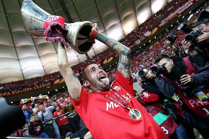 Sevilla's Aleix Vidal celebrating after winning the UEFA Europa League Final on May 27, 2015. -- PHOTO: REUTERS