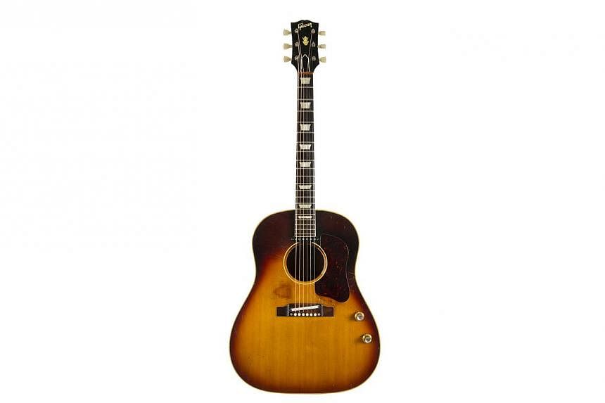 The jumbo J-160E Gibson Acoustic guitar, purchased by Lennon in Liverpool, is expected to fetch between US$600,000 and US$800,000 (S$1,079,000) when it goes on sale on Nov 6 at an auction of rock'n'roll memorabilia in Beverly Hills. -- PHOTO: REUTERS