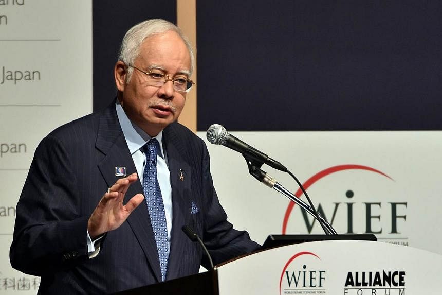 Malaysian Prime Minister Najib Razak delivers an opening speech for the round table meeting of the World Islamic Economic Forum (WIEF) Foundation and Alliance Forum Foundation (AFF) in Tokyo on May 26, 2015. -- PHOTO: AFP