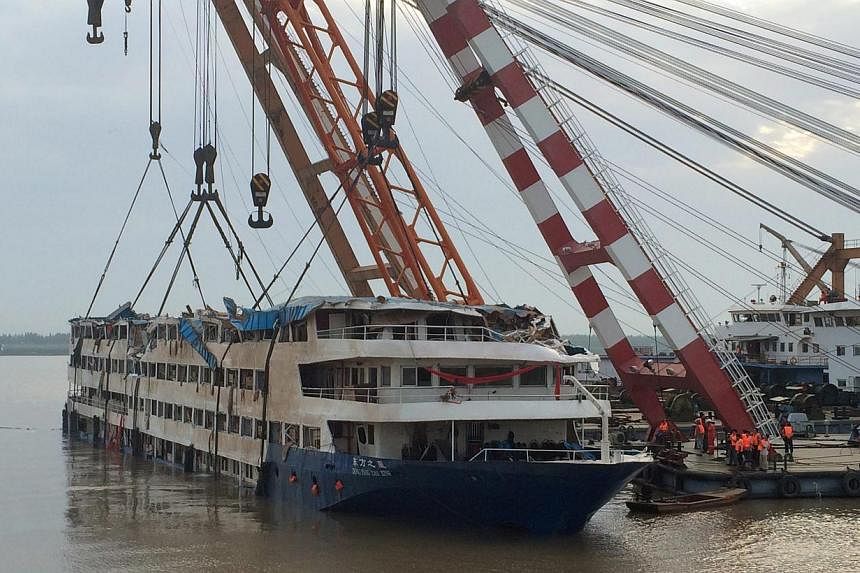 The cruise ship Dong Fang Zhi Xing, which capsized in the Yangtze River, after it was righted in Jianli county, southern China's Hubei province, June 5, 2015. -- PHOTO: EPA&nbsp;