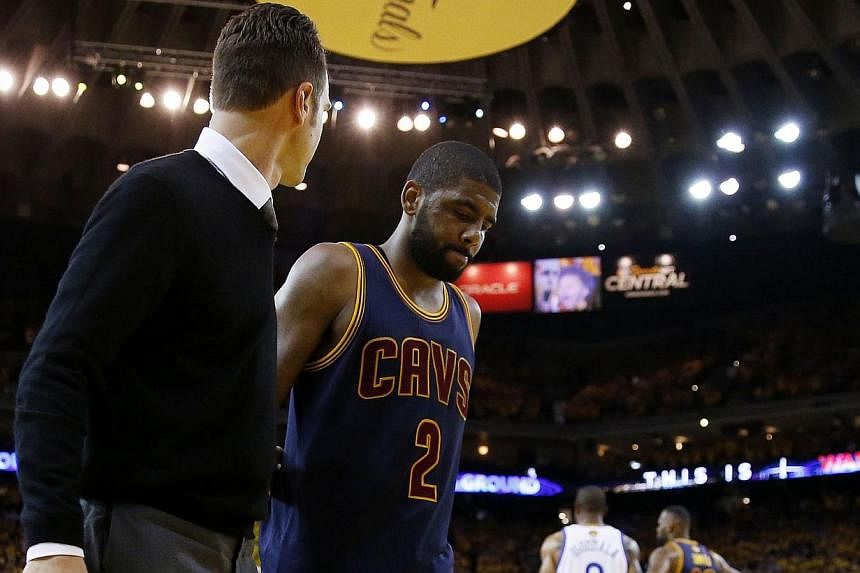 Cleveland Cavaliers point guard Kyrie Irving leaves the court after an injury during the game against the Golden State Warriors in Oakland, California, on Friday, June 5, 2015. Irving will miss the rest of the championship series against the Warriors
