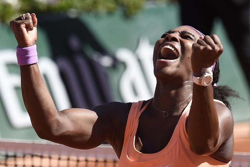 Serena Williams of the US celebrates after defeating Lucie Safarova of the Czech Republic&nbsp;during their women's final match of the Roland Garros French Tennis Open in Paris on June 6, 2015. -- PHOTO: AFP