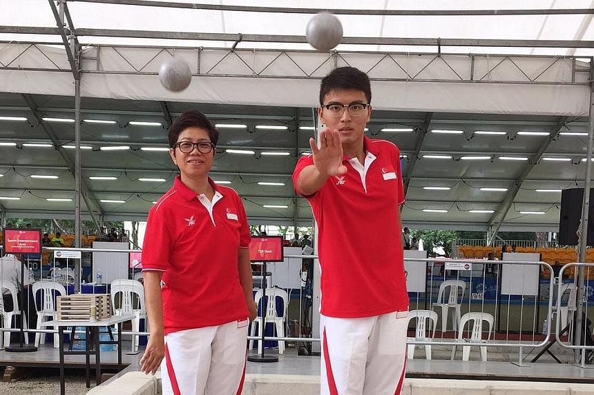 Men's petanque captain Cheng Zhi Ming (right) failed to qualify for the shooting semi-finals. Teammate Heo Boon Huay (left) also suffered a similar fate. -- ST PHOTO: JEREMY LIM&nbsp;