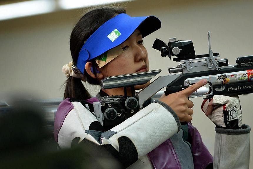 Jasmine Ser (above), Tessa Neo and Martina Lindsay Veloso beat rivals Malaysia with a convincing total score of 1233.9 points in the event. -- PHOTO: ST FILE