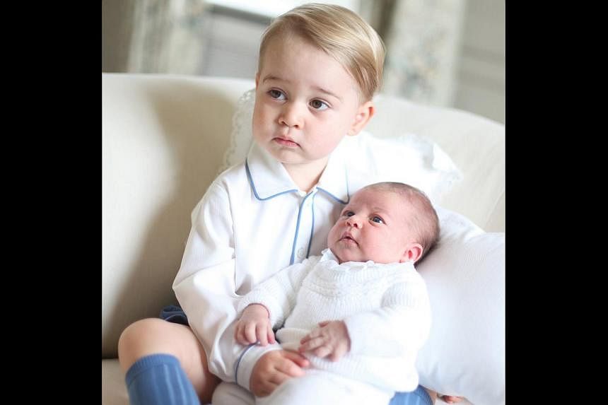 Prince George and Princess Charlotte are seen in this handout photo taken by the Duchess in mid-May at Anmer Hall in Norfolk and released by the Duke and Duchess of Cambridge on June 6, 2015. -- PHOTO: REUTERS