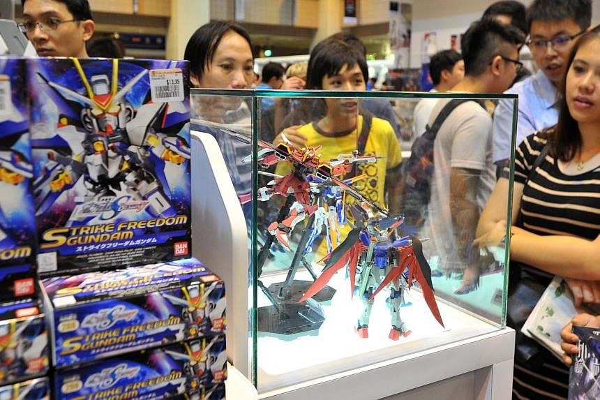 Gundam models on display in the exhibition of over 200 Gundam models at Takashimaya Square on June 6, 2015. -- PHOTO: LIM YAOHUI FOR THE STRAITS TIMES