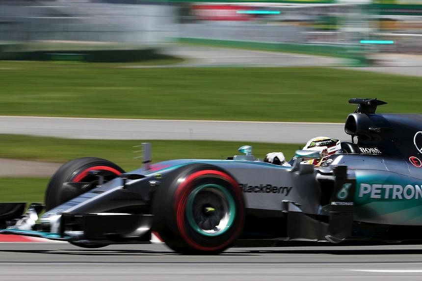 Mercedes Formula One driver Lewis Hamilton of Britain drives his car during the qualifying session of the Canadian F1 Grand Prix at the Circuit Gilles Villeneuve in Montreal on June 6, 2015. -- PHOTO: REUTERS