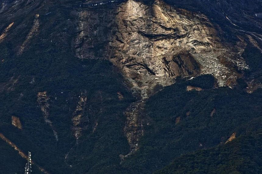 A general view of a landlside on the side of the Kinabalu Mountain as a rescue mission continues for more than 130 climbers stranded on one of Southeast Asia's highest mountains after an earthquake, Sabah, in Kundasang, Malaysia, on June 6, 2015. -- 