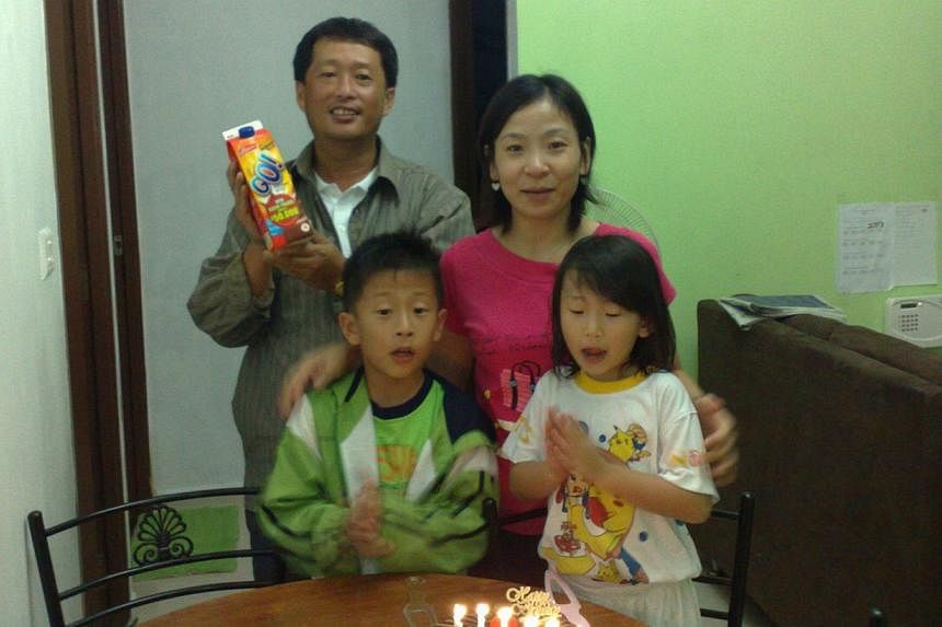 Peony (in white) celebrating her sixth birthday with her parents and brother, Chester. -- PHOTO: COURTESY OF ALSON WEE