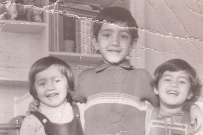 In 2004, Geraldine Ang (left) spent a year in Tigray, northern Ethiopia, working in a refugee camp which housed 10,000 people. A childhood photograph of Mr Schoeib Sabri (centre) with his brother Mustafa (left) and sister Maryam (right). The photo is