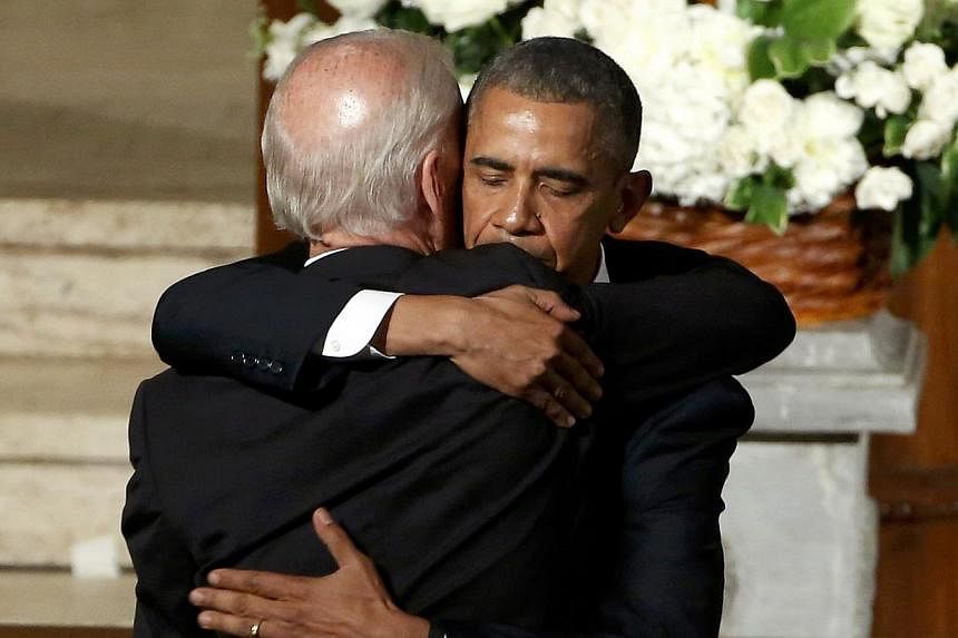 US President Barack Obama (right) hugs Vice-President Joe Biden during the funeral of the latter's son, former Delaware attorney-general Beau Biden, at St. Anthony of Padua Church in Wilmington, Delaware on June 6, 2015. -- PHOTO: REUTERS