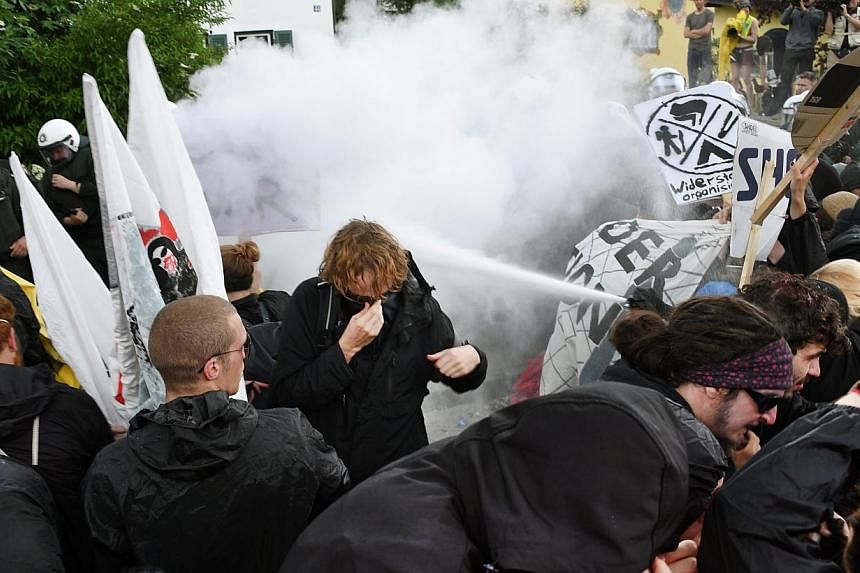 Protestors and police officers clash duirng a protest in Garmisch-Partenkirchen, Germany, on June 6, 2015. Police reported isolated incidents and in one case deployed pepper spray to disperse some protesters, but&nbsp;the demonstration against the G7
