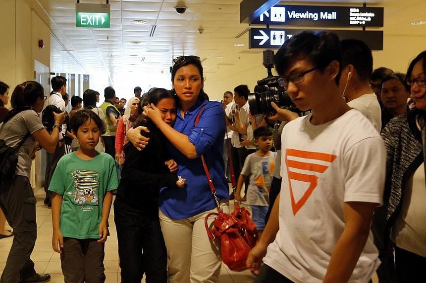 A group of students and teachers from Tanjong Katong Primary School landing at Changi Airport Terminal 2. -- ST PHOTO: CHEW SENG KIM