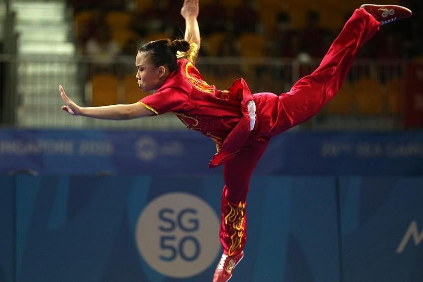 Singapore's Zoe Mui clinched the gold in the women's changquan (optional) event held at the Singapore Expo on June 7, 2015. -- ST PHOTO: SEAH KWANG PENG