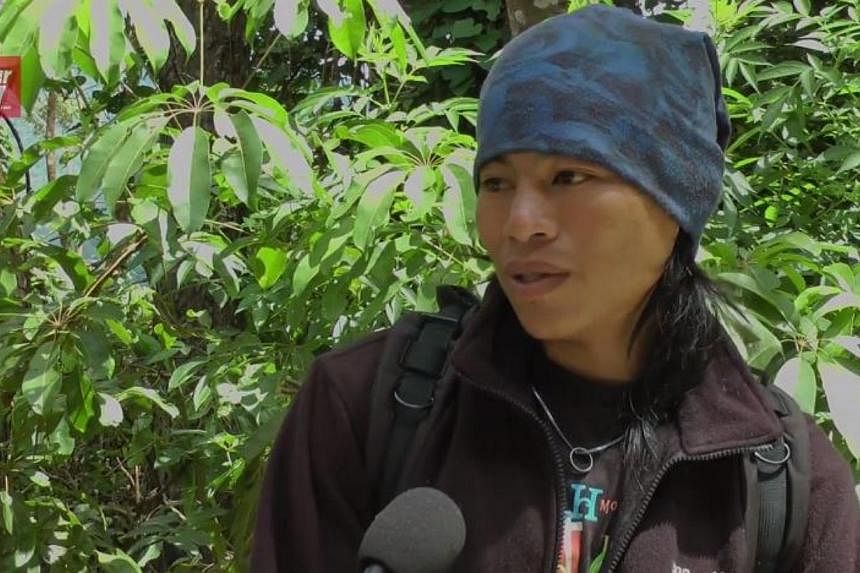 Mountain guide Mhd Rizuan Kauhinin hopes to meet the boy he rescued after the earthquake on Mount Kinabalu on June 6, 2015. -- PHOTO: SCREENGRAB FROM YOUTUBE