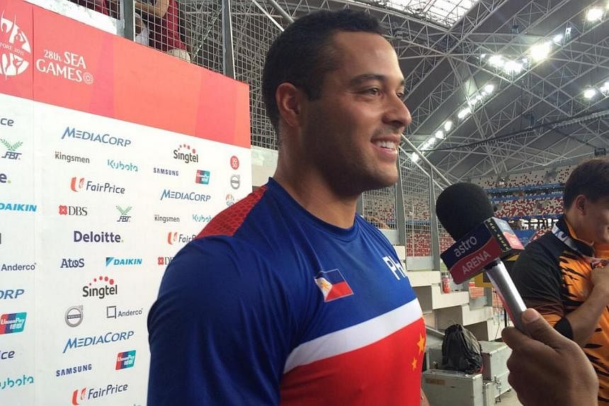 Filipino Caleb John Christian Stuart being interviewed after winning the gold in the SEA Games hammer throw event on June 9, 2015. He also set a new Games record of 65.63m. -- ST PHOTO: CHUAN LIMIN&nbsp;