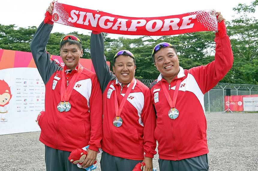 Singapore's men's skeet team silver medallists (from left) Low Jiang Hao, Eugene Chiew and David Chan at the National Shooting Centre on June 9, 2015. -- ST PHOTO: SEAH KWANG PENG