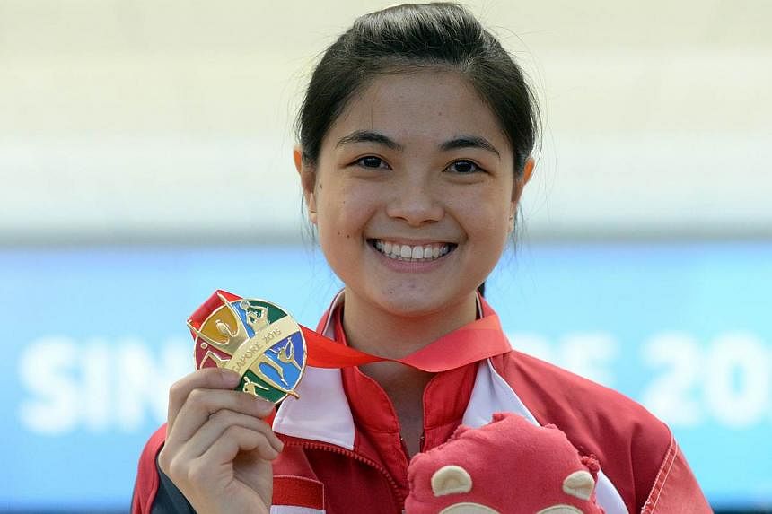Singapore bowler Daphne Tan with her gold medal after winning the women's singles on June 9, 2015.&nbsp;-- ST PHOTO: DESMOND FOO