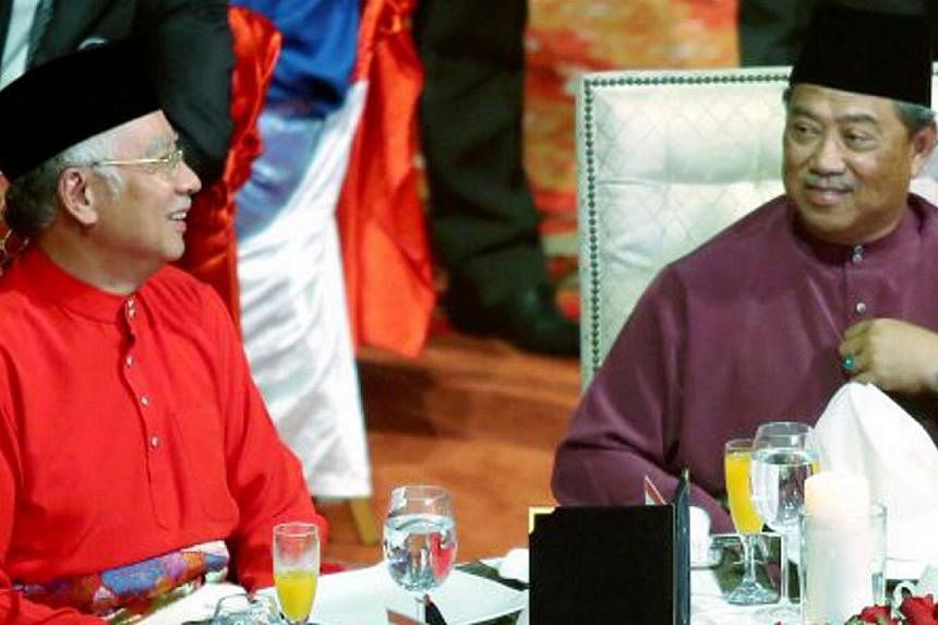 Malaysian Prime Minister Najib Razak (left) with Deputy Prime Minister Tan Sri Muhyiddin Yassin at the 2015 Umno Supreme Council meeting at the Putra World Trade Centre on May 12, 2015. -- PHOTO: NSTP&nbsp;