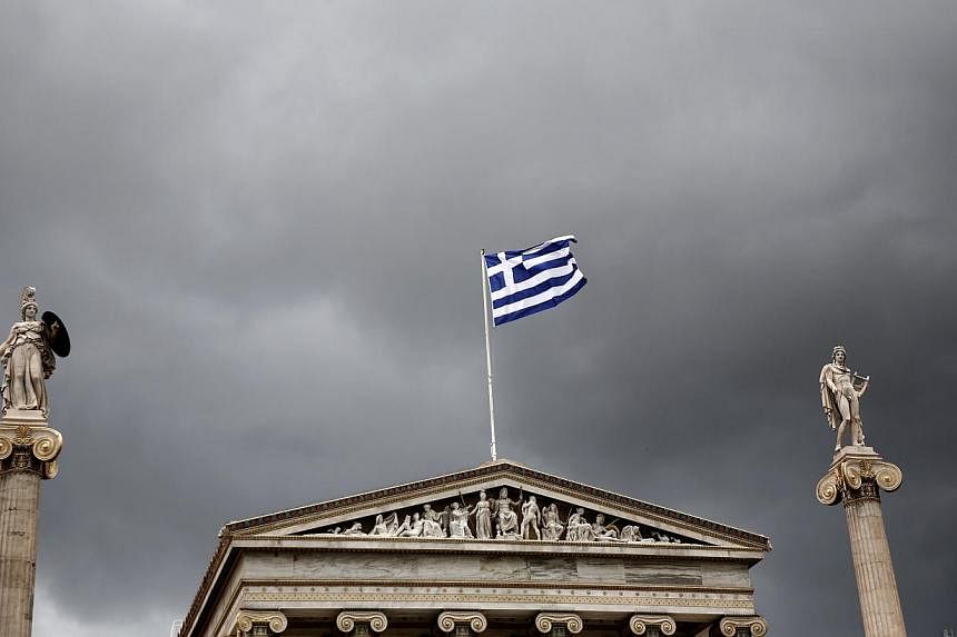 Statues of the Greek goddess Athena (left) and god Apollo flank Greece's national flag atop the Athens Academy. Greece has made clear its willingness to engage in continued reforms. A dose of reality on the part of Greece's creditors - about what is 