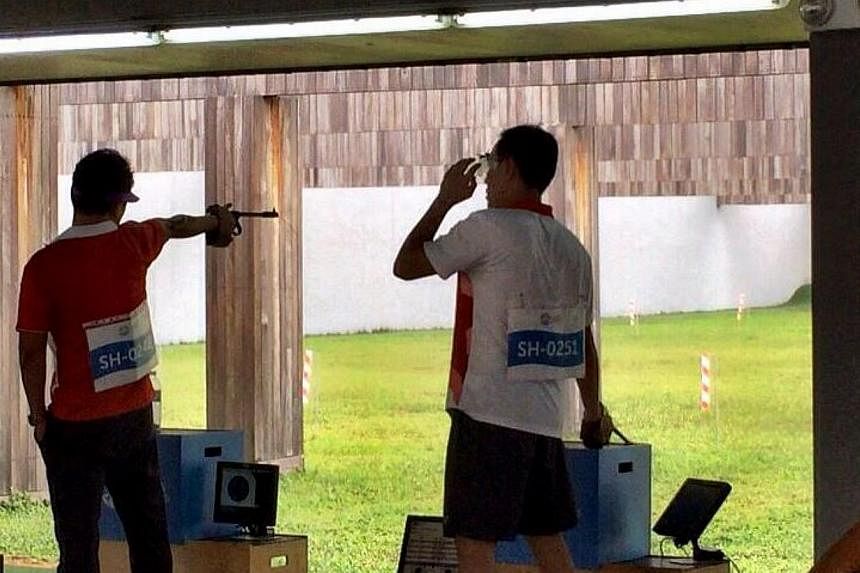 Host Singapore's 50m pistol team of Gai Bin, Nigel Lim and Poh Lip Meng struck their first gold at this SEA Games, combining to register 1,632 points, ahead of Vietnam (1,626) and Malaysia (1,615). -- PHOTO: ST SPORTS DESK/TWITTER