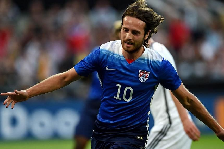 US midfielder Mix Diskerud celebrates scoring the equaliser during the International friendly football match between Germany and the US in Cologne, Germany on June10, 2015. The US won the match 2-1. -- PHOTO: AFP