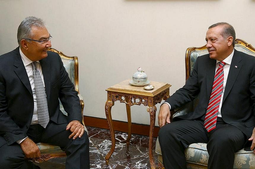 Turkey's President Recep Tayyip Erdogan (right) meets with Mr Deniz Baykal, a veteran opposition lawmaker from the Republican People's Party (CHP), in Ankara, Turkey, on June 10, 2015. -- PHOTO: REUTERS