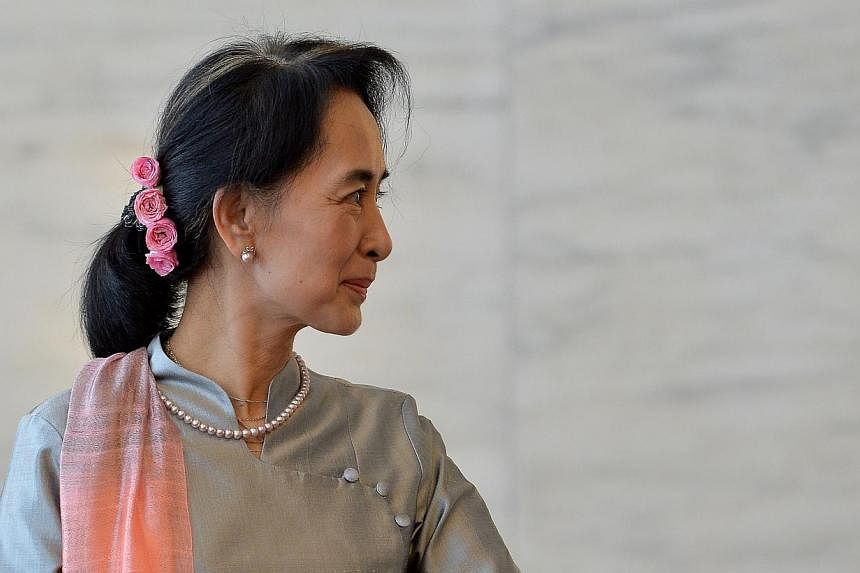 Myanmar's ruling party on Thursday released a draft bill on changes to its junta-era constitution that could end an effective army veto on charter amendments, but still bars opposition leader Aung San Suu Kyi from the presidency. -- PHOTO: AFP&nbsp;