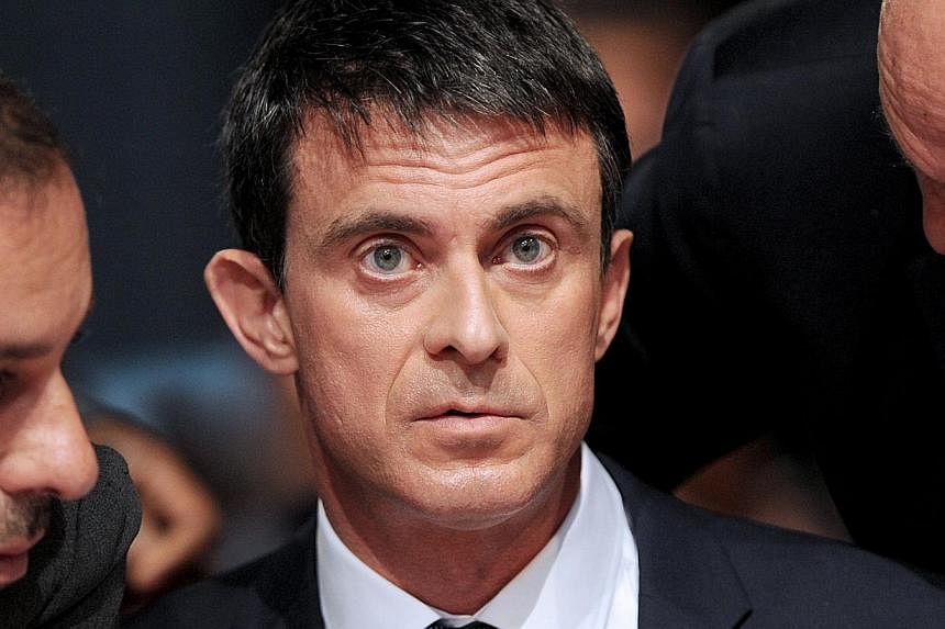 France's prime minister Mr Manual Valls has come under intense pressure after it emerged he used a government jet to transport himself and his two sons to Berlin on Saturday for the final between Barcelona and Juventus. -- PHOTO: AFP&nbsp;