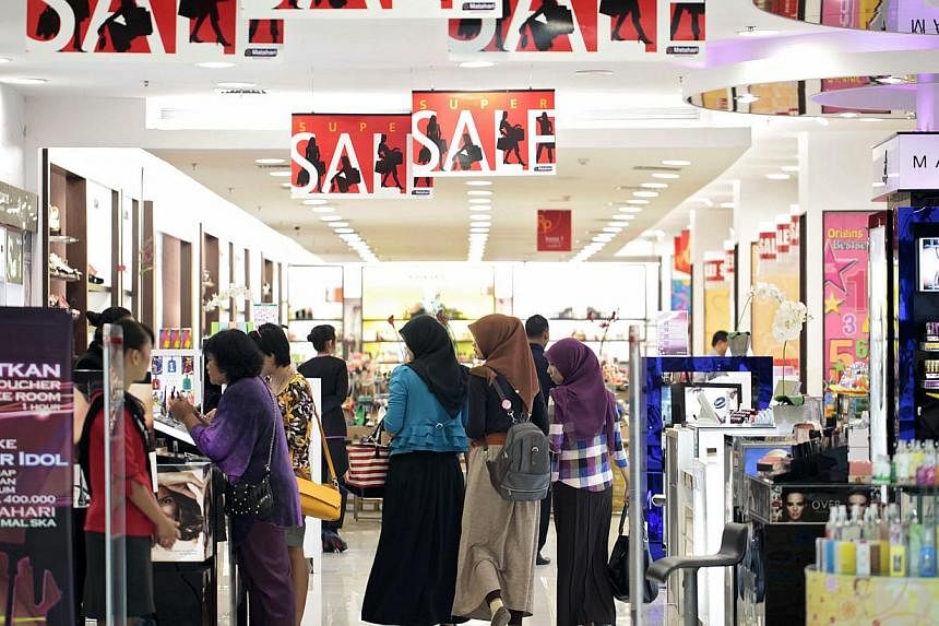Customers browse inside the Mal Ska shopping mall in Pekanbaru, Riau province, Indonesia. The country is exempting most goods from a luxury tax in a bid to boost household consumption and revive faltering economic growth, says Jakarta's finance minis