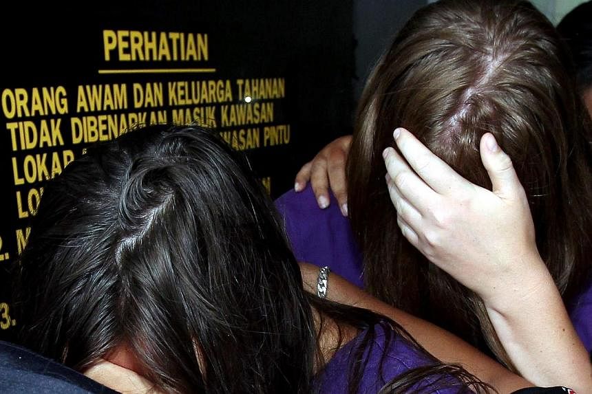 Two of the four tourists remanded by police for desecrating Mount Kinabalu, a sacred site, have confessed to going naked while on the mountain.&nbsp;-- PHOTO: THE STAR/ASIA NEWS NETWORK