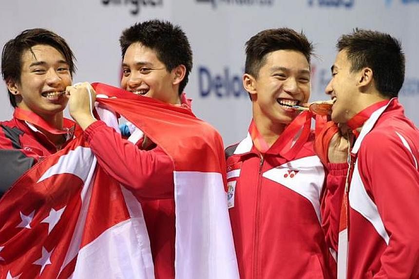 Singapore's Quah Zheng Wen, Lionel Khoo, Joseph Schooling and Clement Lim win the gold medal for the 28th SEA Games swimming men's 4x100m medley relay final held at the OCBC Aquatic Centre on June 11, 2015.&nbsp;- ST PHOTO: NEO XIAOBIN