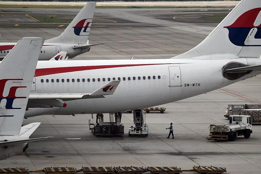A Malaysia Airlines (MAS) flight returned safely to Melbourne on Friday, having turned back within minutes of take-off after an engine fire alert went off, Air Services Australia said. -- PHOTO: AFP