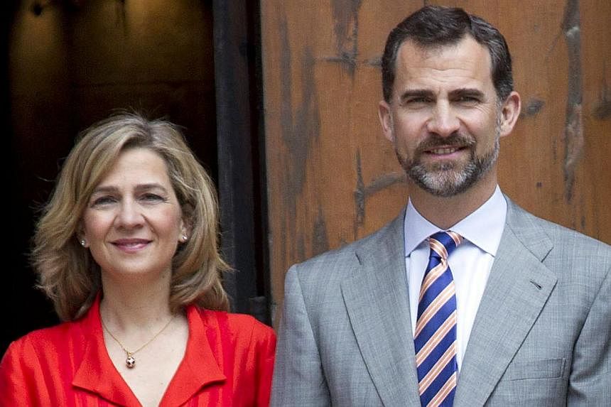 Cristina of Spain (left) and her brother King Felipe VI posing as they arrive for the traditional Easter Mass of Resurection in Palma de Mallorca. King Felipe VI has issued a decree stripping his sister Princess Cristina of her title as Duchess of Pa