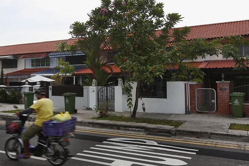 A two-storey unit in Jalan Bahagia (above) went for about $370 psf, while prices for private landed terraced houses nearby have exceeded $2,200 psf this year. In all, 285 such "landed public homes" were built by the Singapore Improvement Trust, HDB's
