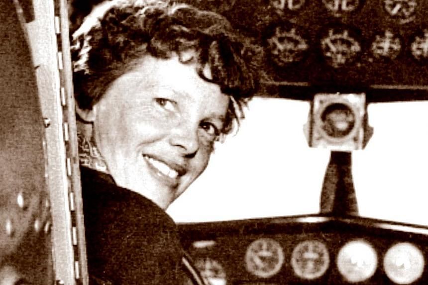 A May 20, 1937, photo shows US aviator Amelia Earhart at the controls of her Lockheed 10 Electra. -- PHOTO: AFP