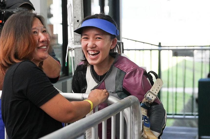 Singapore shooter Jasmine Ser (right) will be aiming to win a gold in the women's 50m rifle three-positions on the final day of the shooting competition on June 12, 2015. -- ST PHOTO: ONG WEE JIN