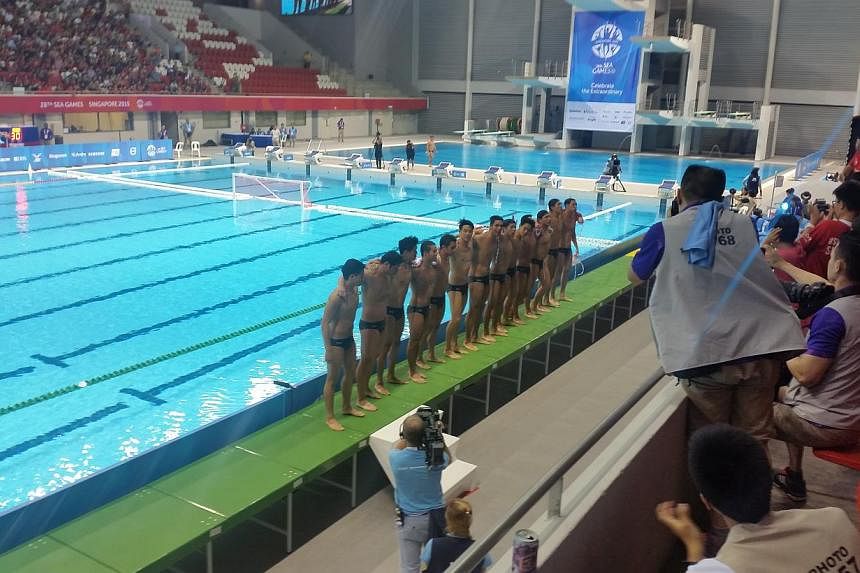 Singapore's men's water polo team acknowledging the crowd after their 17-2 win over Thailand at the OCBC Aquatic Centre on June 12, 2015. -- ST PHOTO: ISAAC NEO&nbsp;