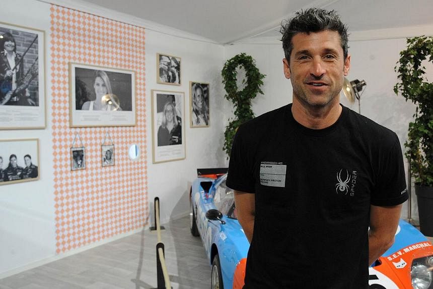 US actor and Porsche 911 driver Patrick Dempsey poses during a press conference before the 83rd Le Mans 24-hour endurance race, on June 12, 2015, in Le Mans, western France. -- PHOTO: AFP
