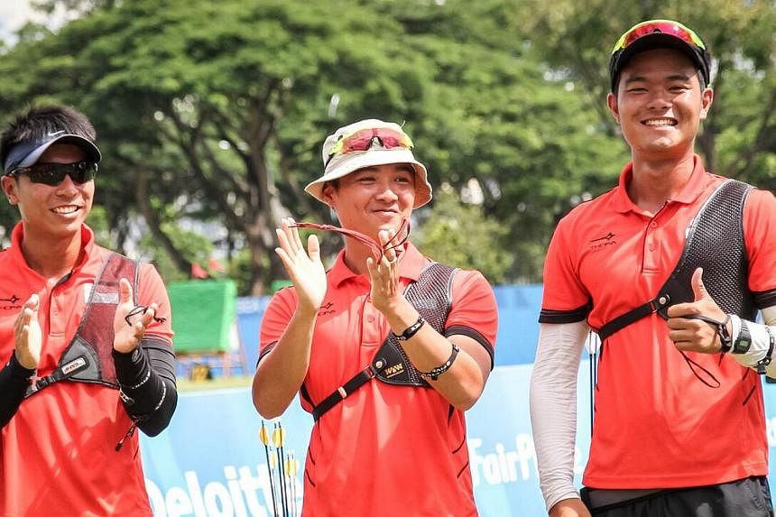 Singapore archers (from left) Tan Si Lie, Keith Teo and Zhang Jingkang won bronze in the&nbsp;men's team recurve event on June 13, 2015. -- PHOTO:&nbsp;DYAN TJHIA/SPORT SINGAPORE