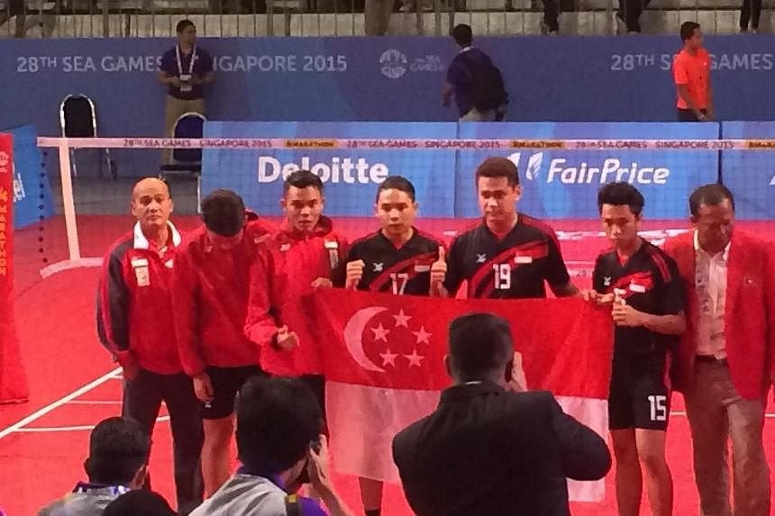 The Singapore men's sepak takraw team clinched their first medal in over two decades with a silver in the final men's regu match on June 13, 2015. -- ST PHOTO: LIM CHING YING